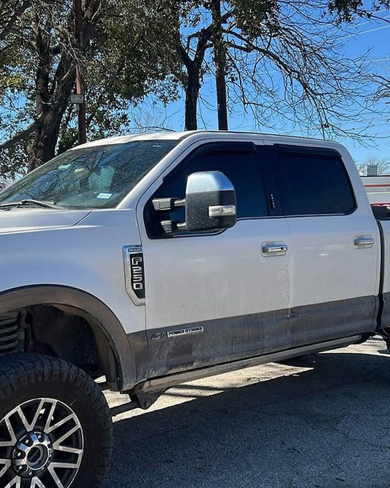 A Ford F-250 with the two front windows tinted to the legal 25%